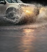 Car driving through water