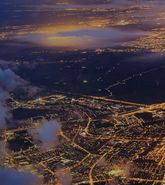 Aerial view of city landscape at night